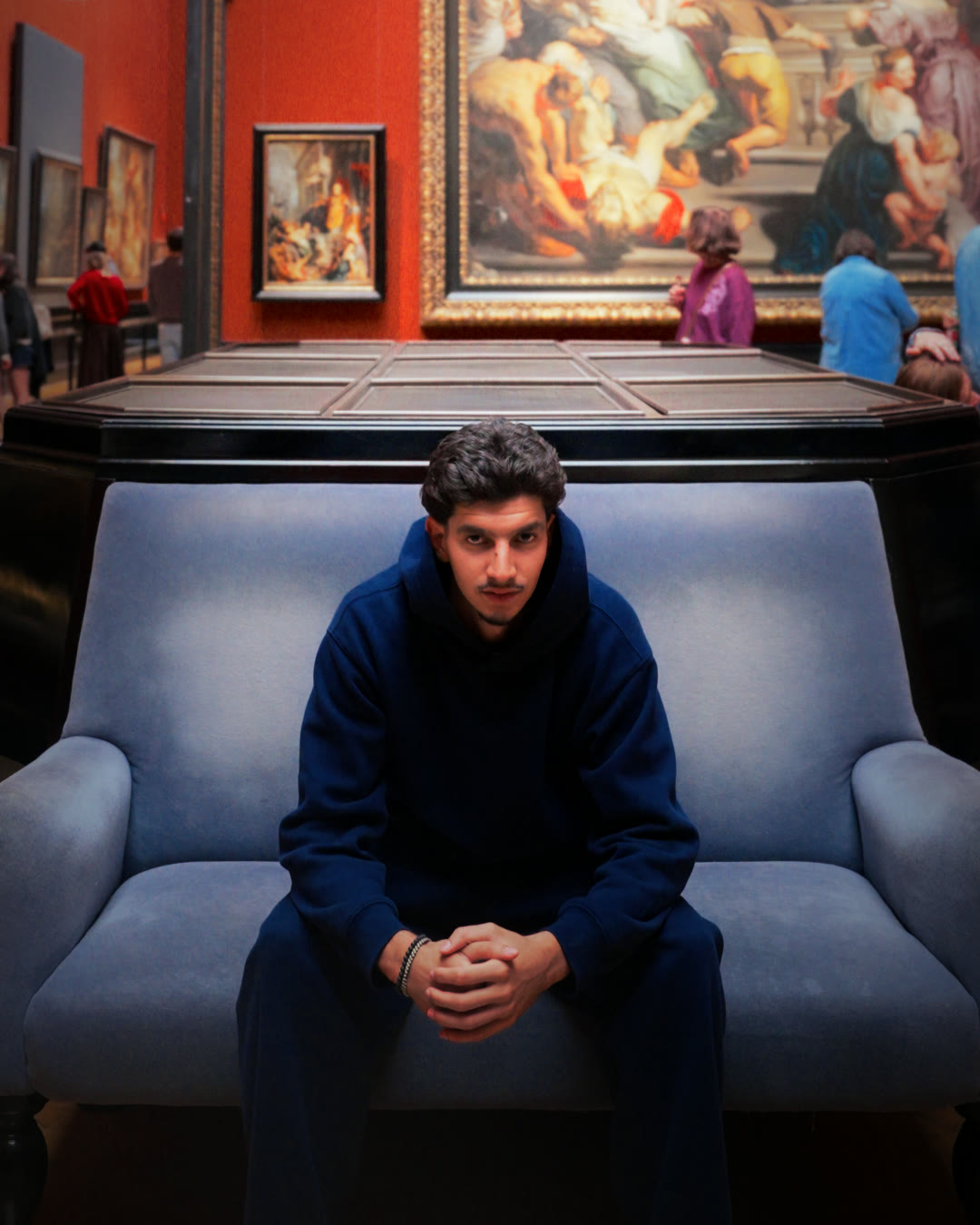 Sofiene Moqrich, seated in a museum gallery