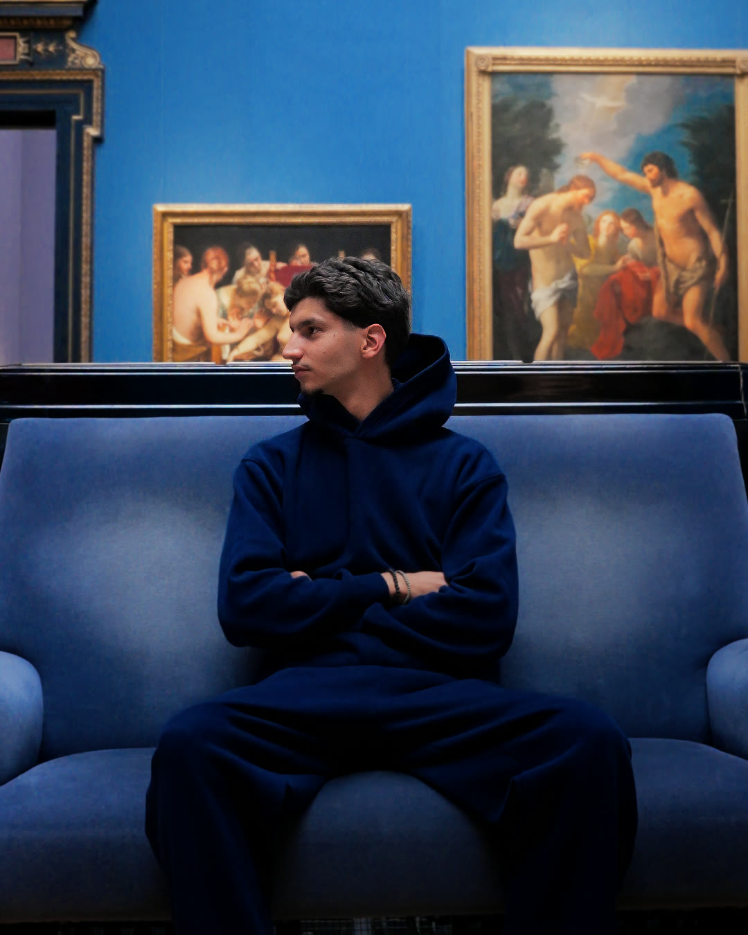Sofiene Moqrich, seated in a museum gallery